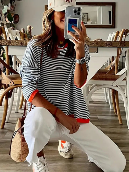 Genimah lichtgewicht trui met dunne strepen en een comfortabele pasvorm, perfect voor een casual en stijlvolle look. Gemaakt van ademend polyester voor langdurig draagcomfort. De levendige oranje tint voegt een frisse en modieuze touch toe aan elke outfit. Ideaal voor dagelijks gebruik en makkelijk te combineren. Verkrijgbaar in maten XS-2XL. Upgrade je garderobe met Genimah en geniet van moeiteloze stijl en comfort. Bestel nu en voeg kleur toe aan je look!