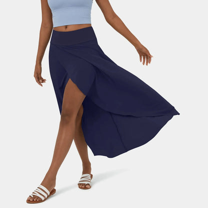 Libra | Elegante Gespleten Maxi Rok - Voeg stijl en comfort toe aan je garderobe met de Libra maxi rok. Ideaal voor elk seizoen dankzij het high-low ontwerp, ruches voor extra volume, en een elegante maxi-lengte. Perfect voor kantoor, avondjes uit of casual dagen. Gemaakt van duurzaam polyester in diverse kleuren: Khaki, Oranje, Roze, Blauw, Vermiljoen en Wijn. Verkrijgbaar in maten XS-XL. Upgrade je looks met deze tijdloze must-have!