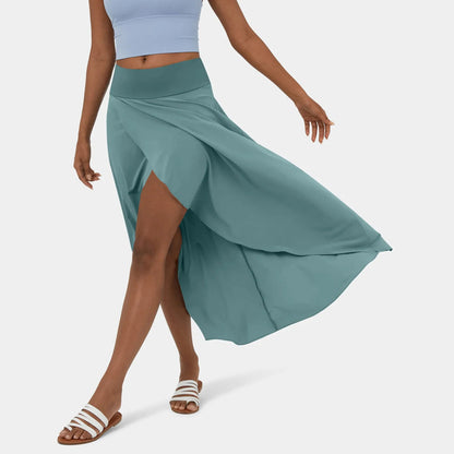 Libra | Elegante Gespleten Maxi Rok - Voeg stijl en comfort toe aan je garderobe met de Libra maxi rok. Ideaal voor elk seizoen dankzij het high-low ontwerp, ruches voor extra volume, en een elegante maxi-lengte. Perfect voor kantoor, avondjes uit of casual dagen. Gemaakt van duurzaam polyester in diverse kleuren: Khaki, Oranje, Roze, Blauw, Vermiljoen en Wijn. Verkrijgbaar in maten XS-XL. Upgrade je looks met deze tijdloze must-have!
