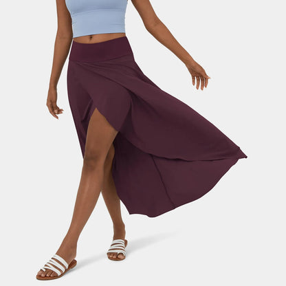 Libra | Elegante Gespleten Maxi Rok - Voeg stijl en comfort toe aan je garderobe met de Libra maxi rok. Ideaal voor elk seizoen dankzij het high-low ontwerp, ruches voor extra volume, en een elegante maxi-lengte. Perfect voor kantoor, avondjes uit of casual dagen. Gemaakt van duurzaam polyester in diverse kleuren: Khaki, Oranje, Roze, Blauw, Vermiljoen en Wijn. Verkrijgbaar in maten XS-XL. Upgrade je looks met deze tijdloze must-have!