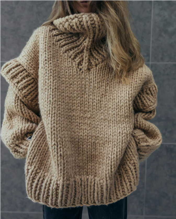 Ontdek de Odessa, een oversized gebreide coltrui die comfort en stijl combineert. Perfect voor koelere dagen, met een grof gebreid design, ontspannen pasvorm en tijdloos silhouet. Draag deze veelzijdige trui met jeans, leggings of rokken voor een knusse en trendy look. Verkrijgbaar in Wit, Zwart, Blauw, Grijs, Legergroen, Khaki en Bruin, in maten S-XL. Voeg warmte en elegantie toe aan je garderobe met de Odessa. Bestel nu en geniet van moeiteloze stijl en ultiem comfort!